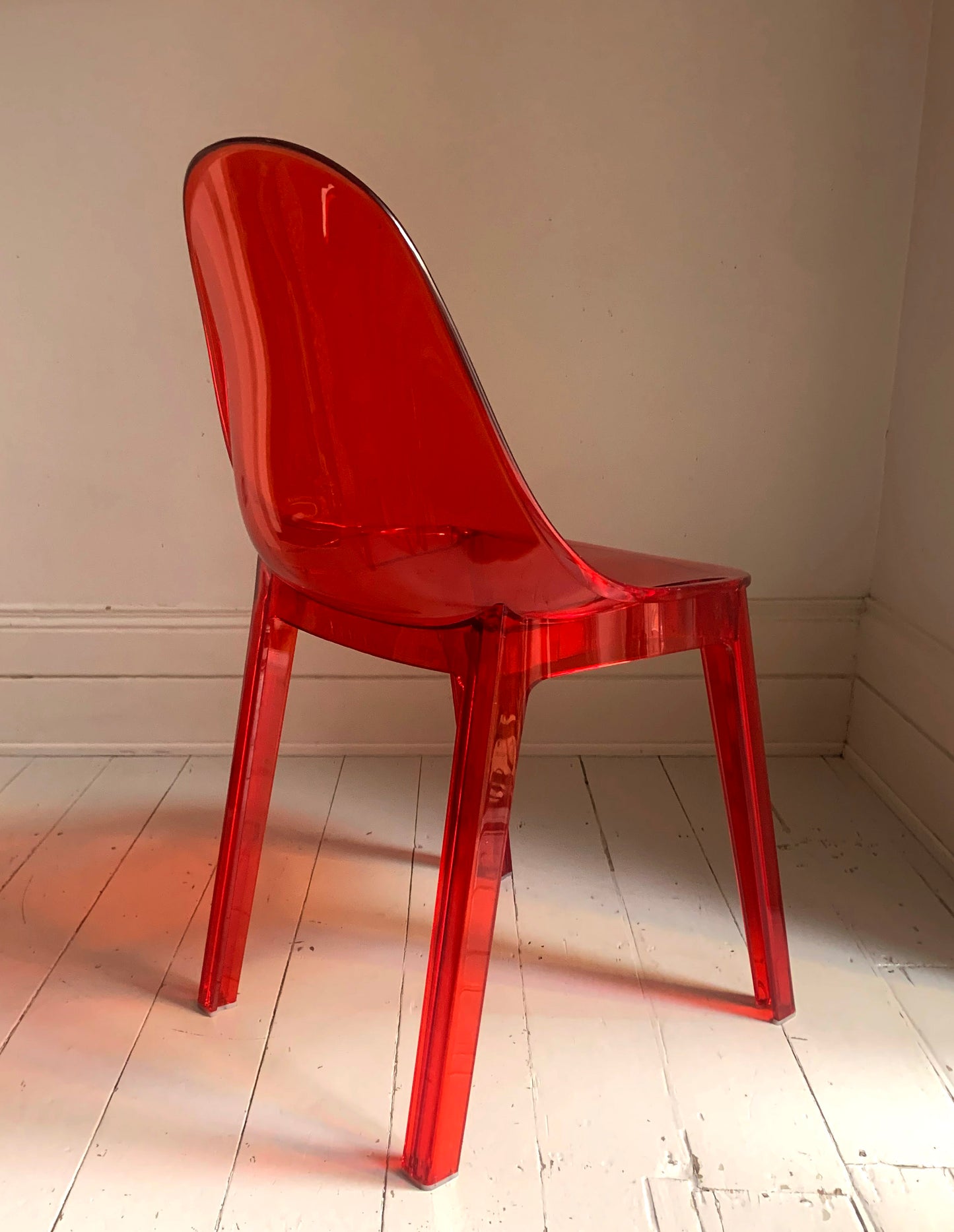 Four x Stackable Dining Chairs in Red Transparent Plastic