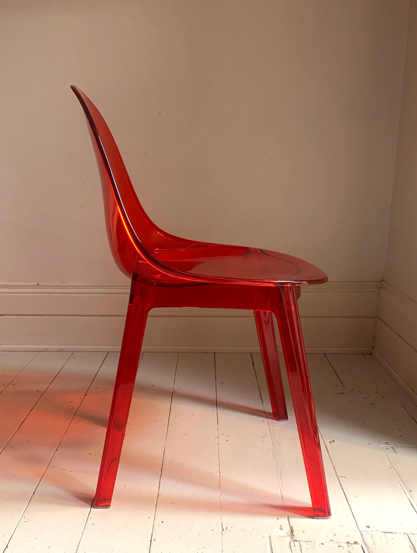 Four x Stackable Dining Chairs in Red Transparent Plastic