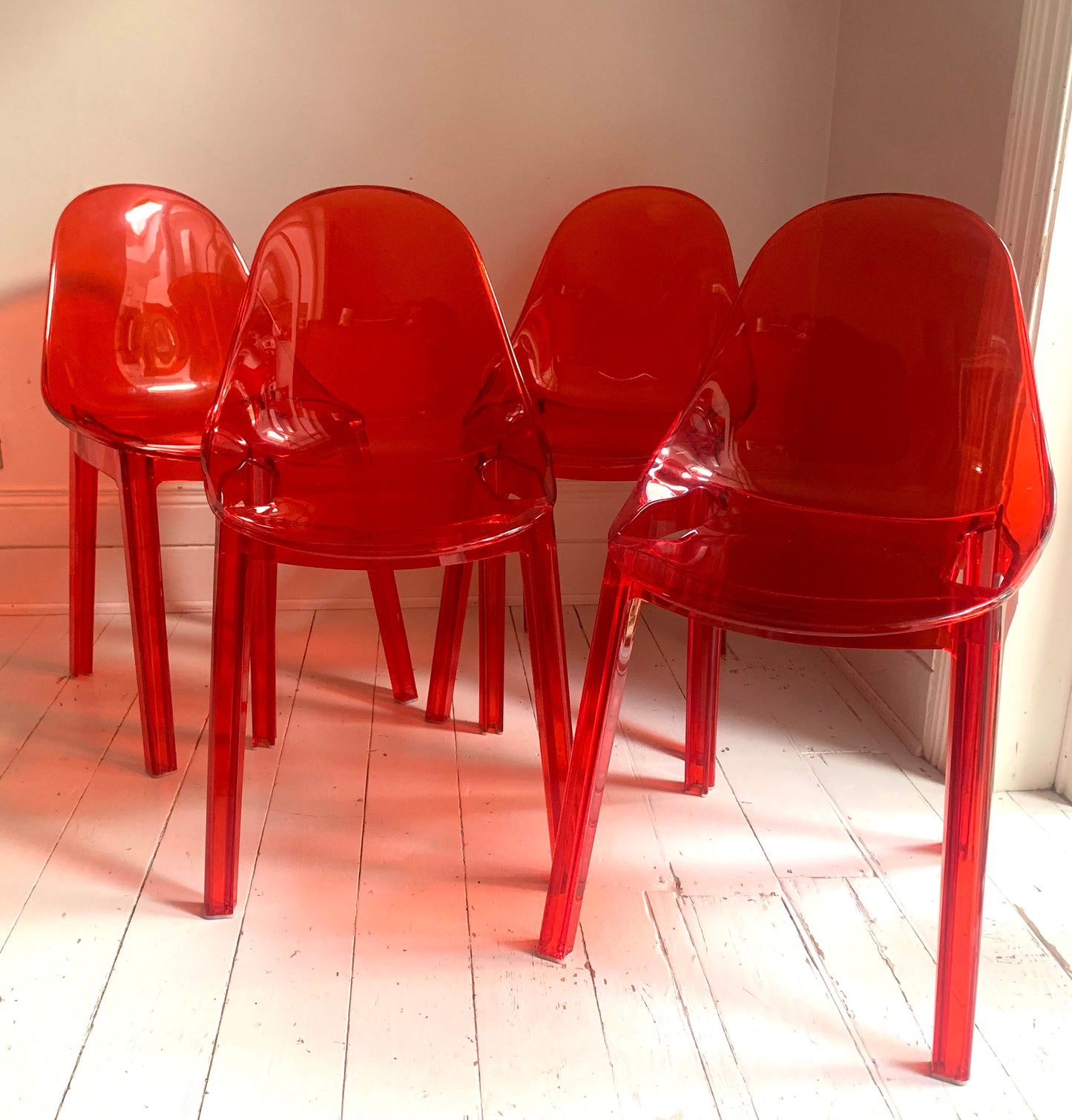 Four x Stackable Dining Chairs in Red Transparent Plastic