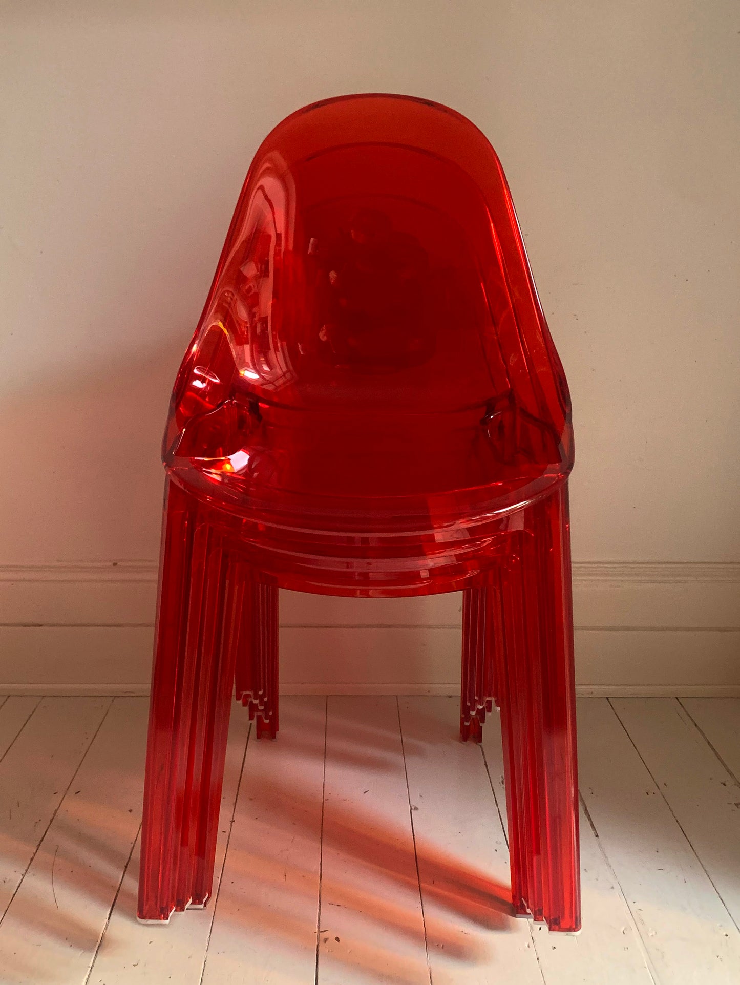 Four x Stackable Dining Chairs in Red Transparent Plastic
