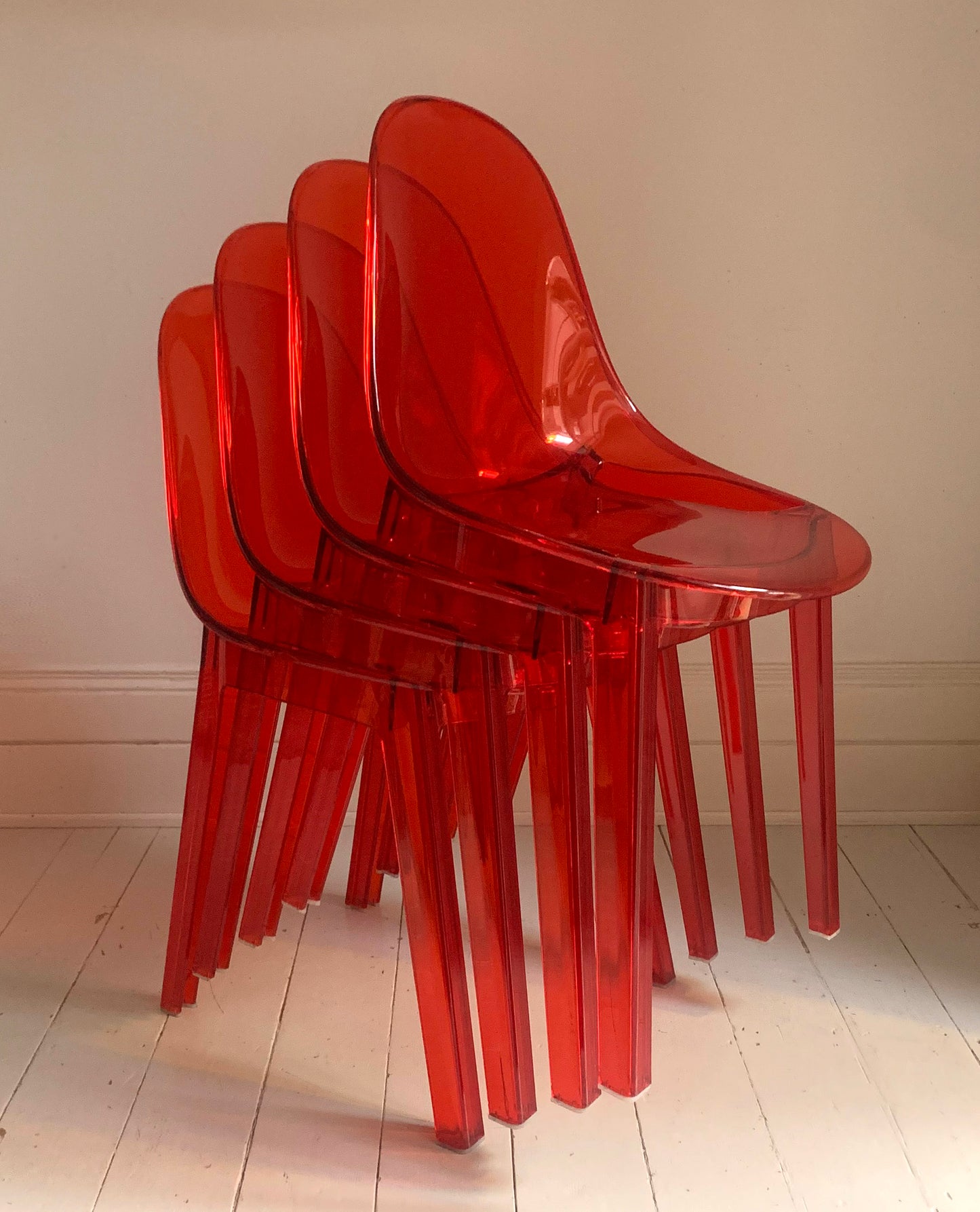 Four x Stackable Dining Chairs in Red Transparent Plastic