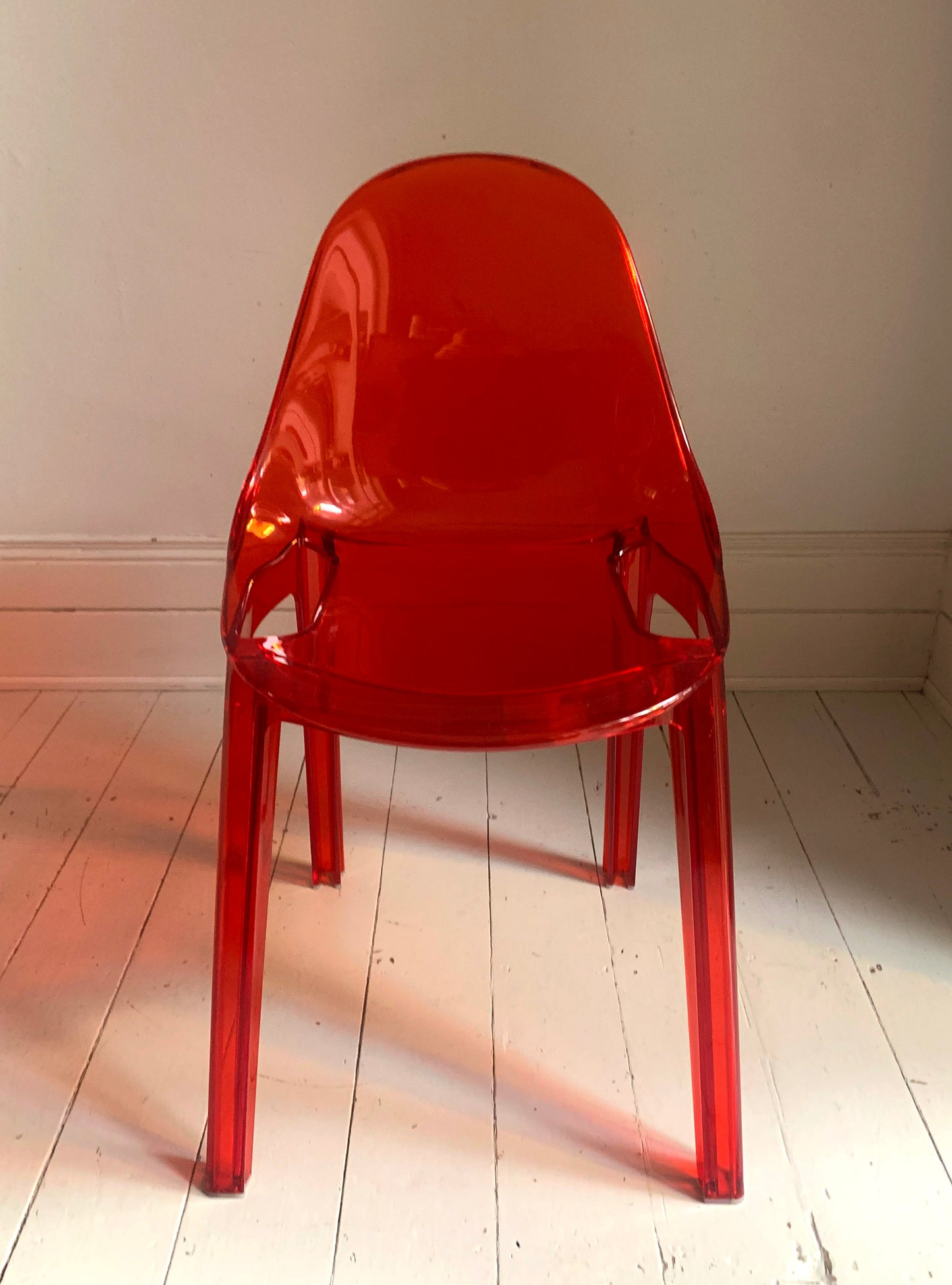 Four x Stackable Dining Chairs in Red Transparent Plastic