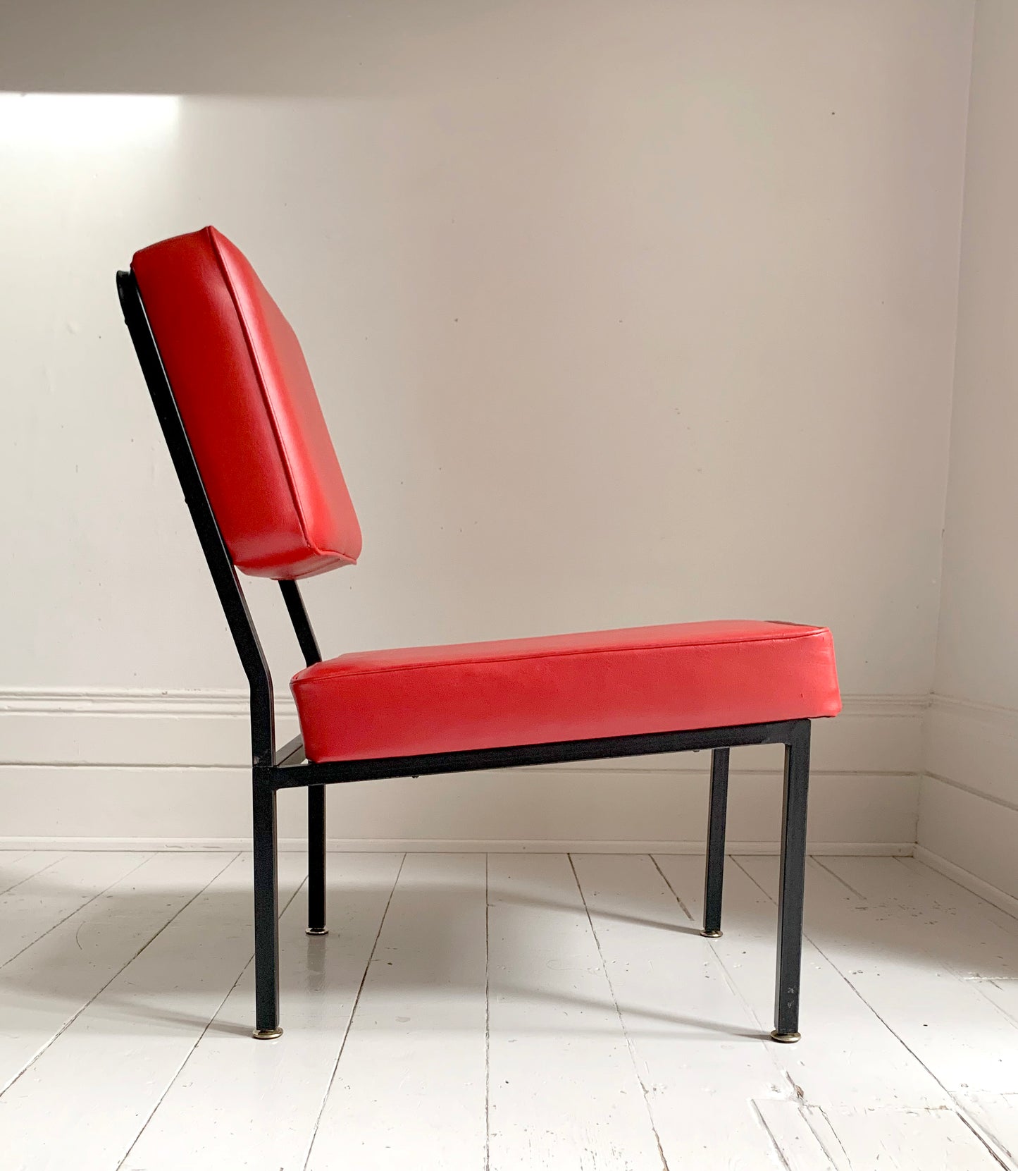 Mid Century Pair of Red Vinyl Lounge Chairs With Brass Feet