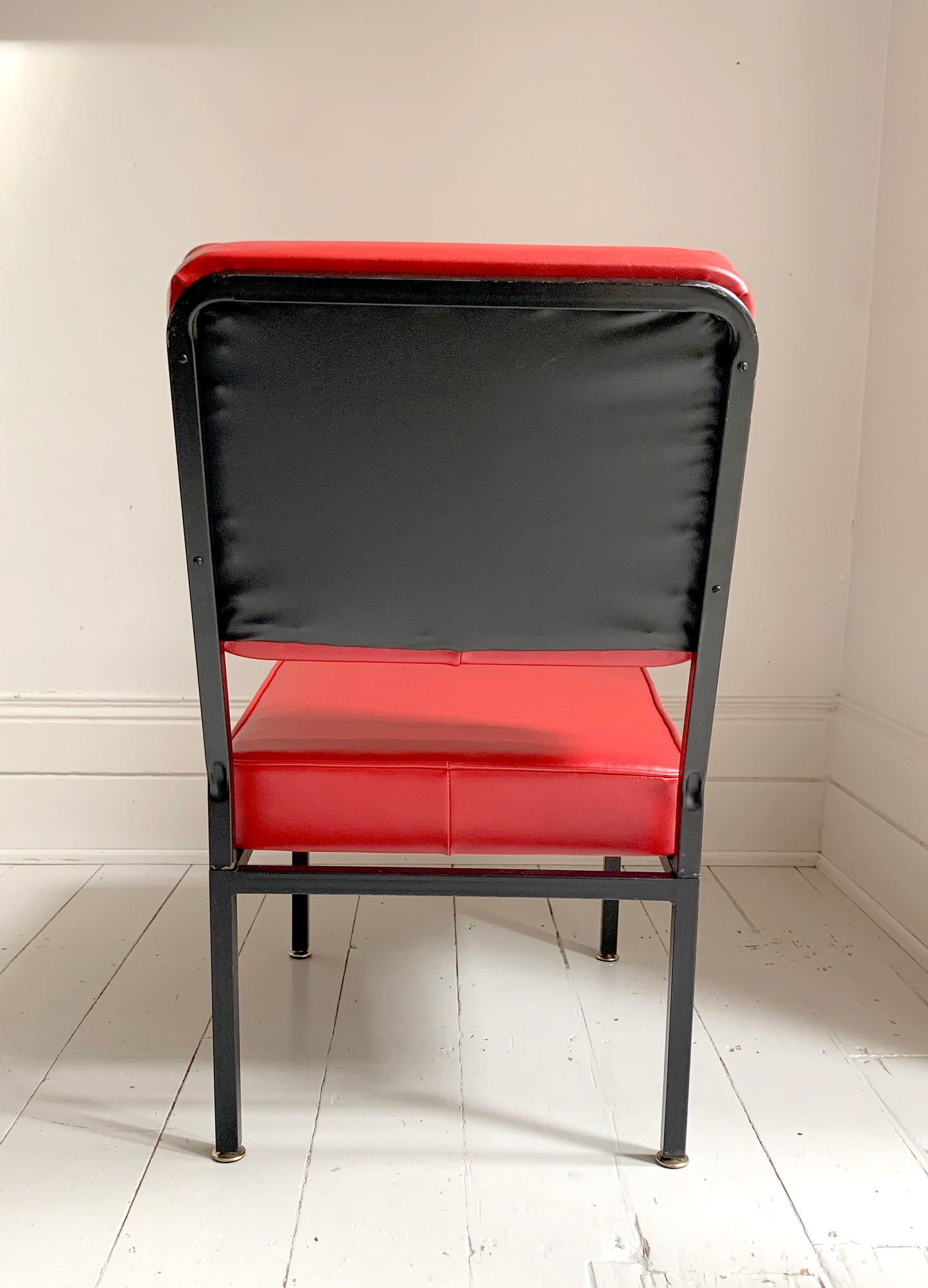 Mid Century Pair of Red Vinyl Lounge Chairs With Brass Feet