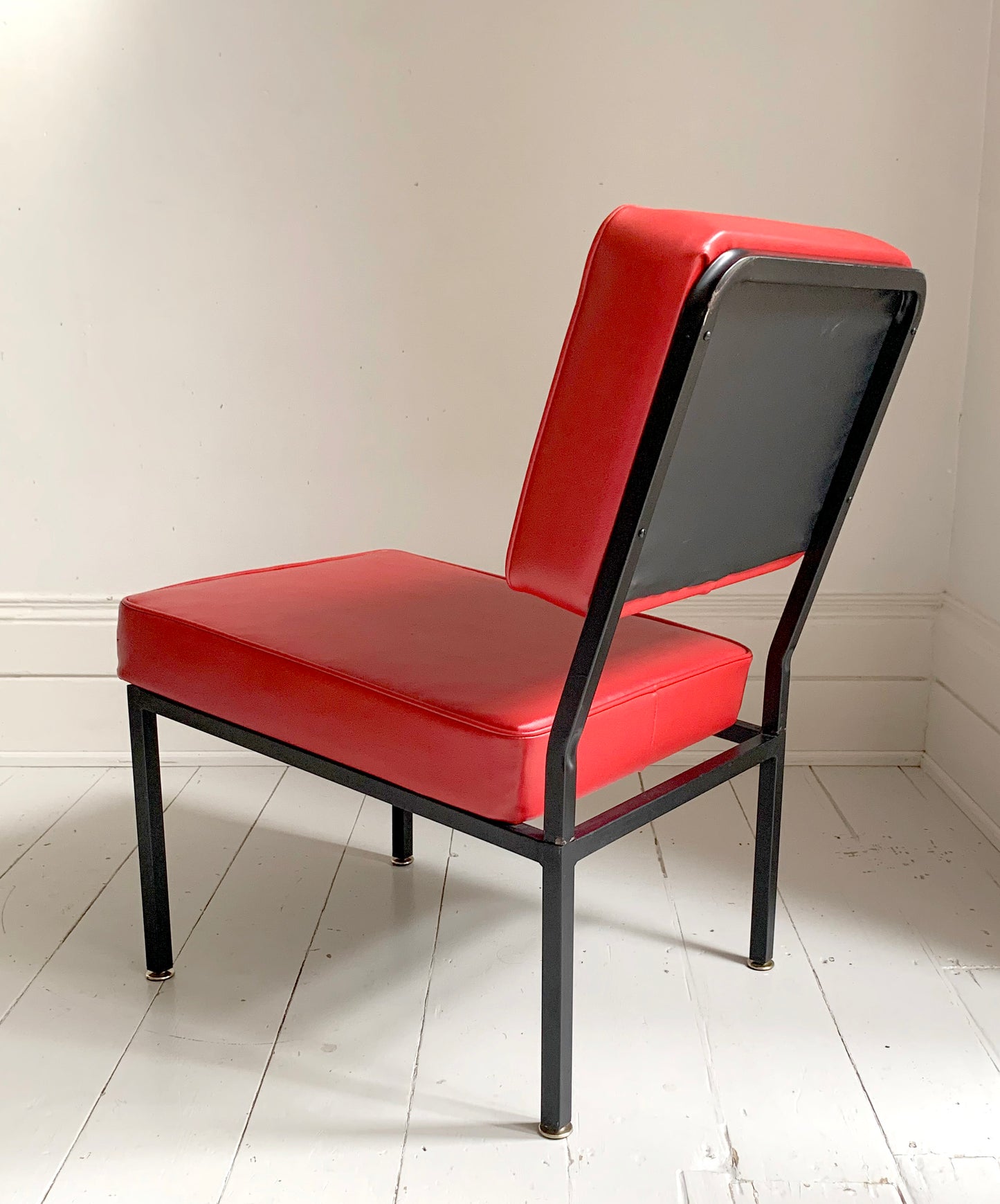 Mid Century Pair of Red Vinyl Lounge Chairs With Brass Feet