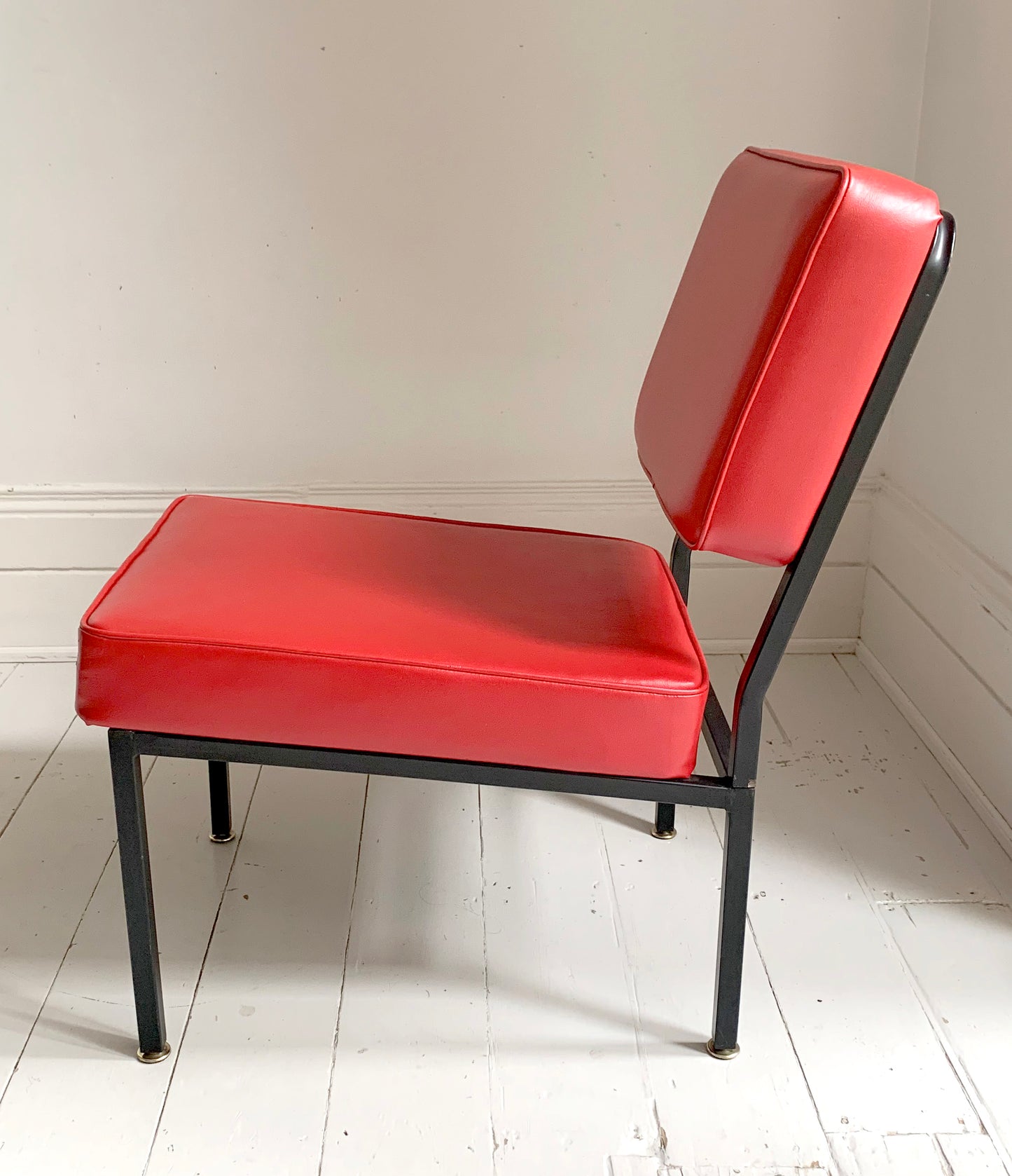 Mid Century Pair of Red Vinyl Lounge Chairs With Brass Feet