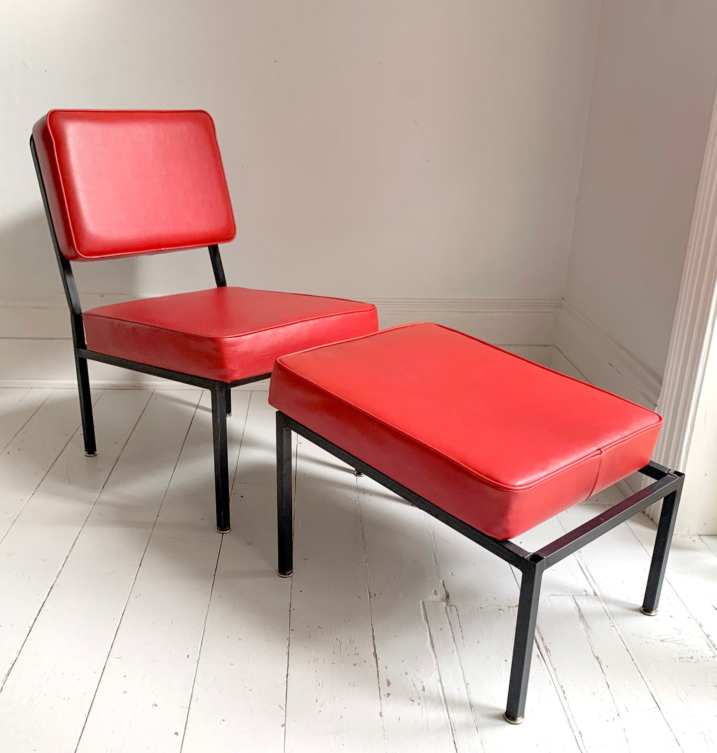 Mid Century Pair of Red Vinyl Lounge Chairs With Brass Feet