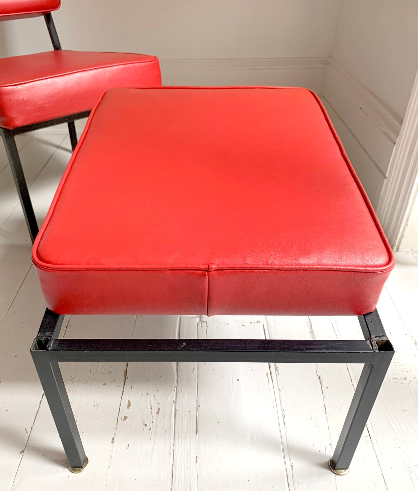 Mid Century Pair of Red Vinyl Lounge Chairs With Brass Feet