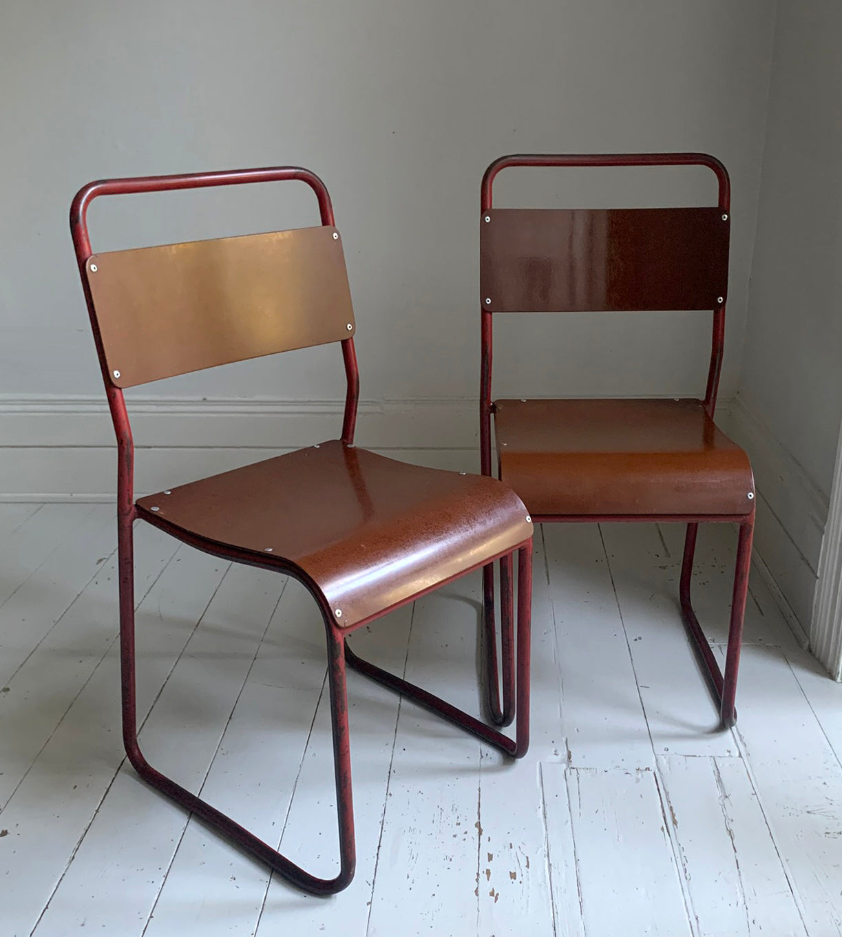 Vintage Cox Stacking Chairs; A Pair Tubular Steel Chairs with Rich Red Patina