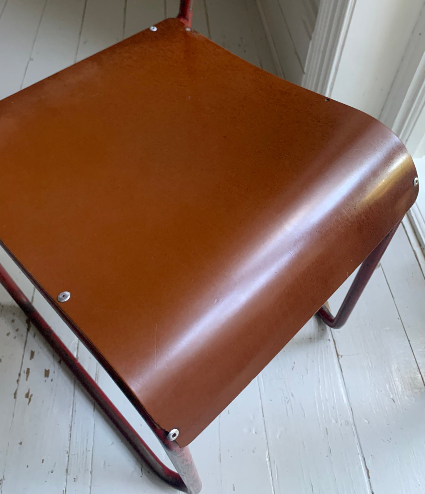 Vintage Cox Stacking Chairs; A Pair Tubular Steel Chairs with Rich Red Patina