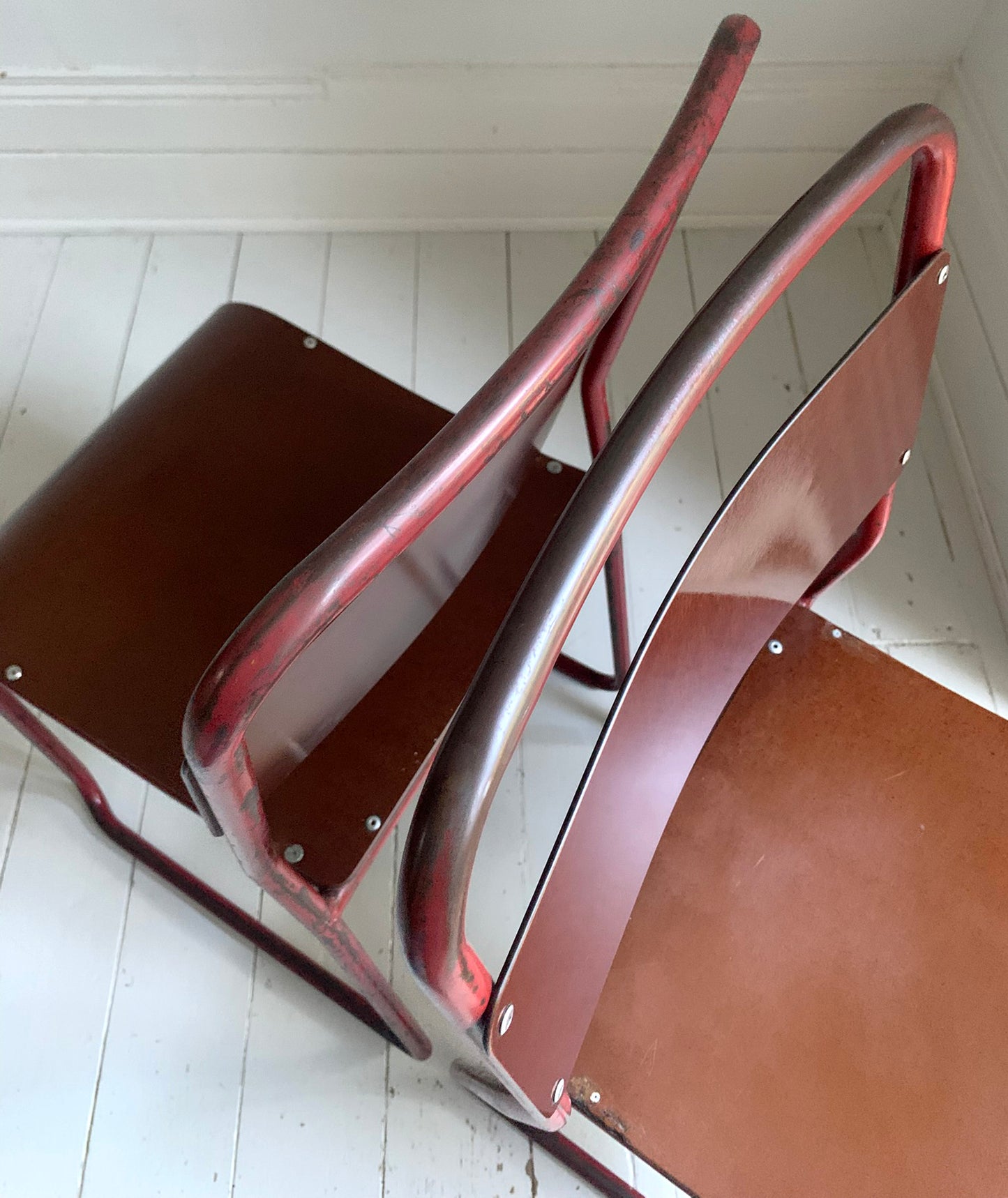 Vintage Cox Stacking Chairs; A Pair Tubular Steel Chairs with Rich Red Patina