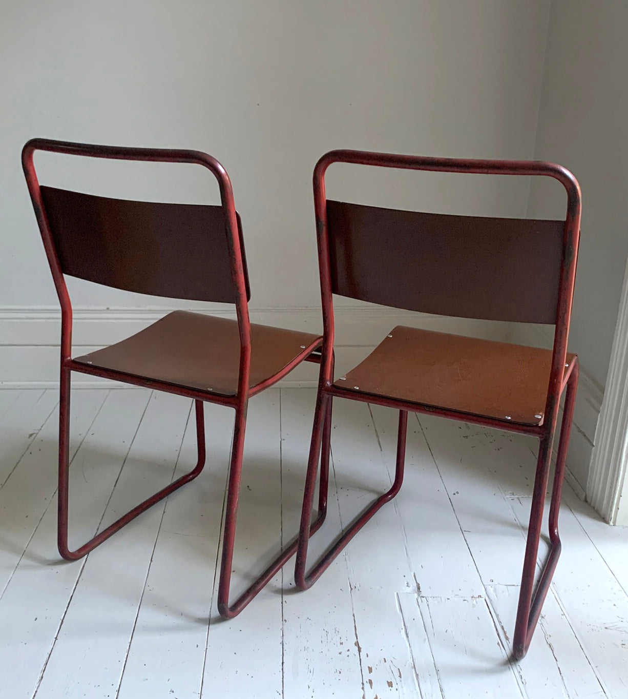 Vintage Cox Stacking Chairs; A Pair Tubular Steel Chairs with Rich Red Patina