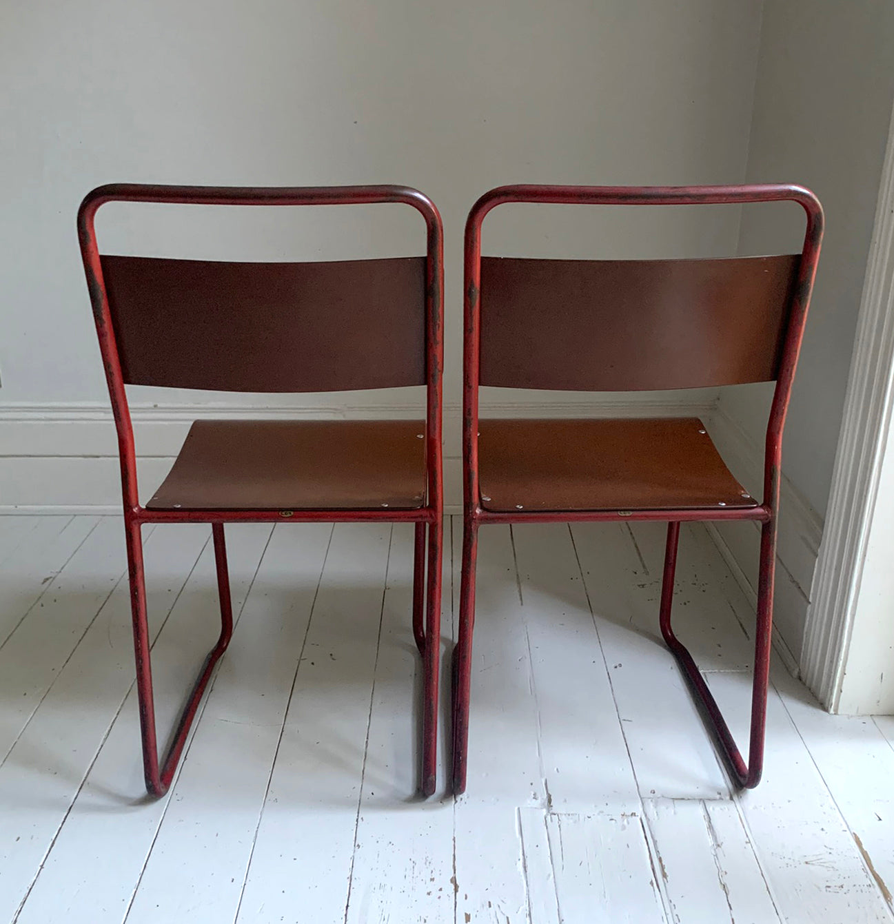 Vintage Cox Stacking Chairs; A Pair Tubular Steel Chairs with Rich Red Patina