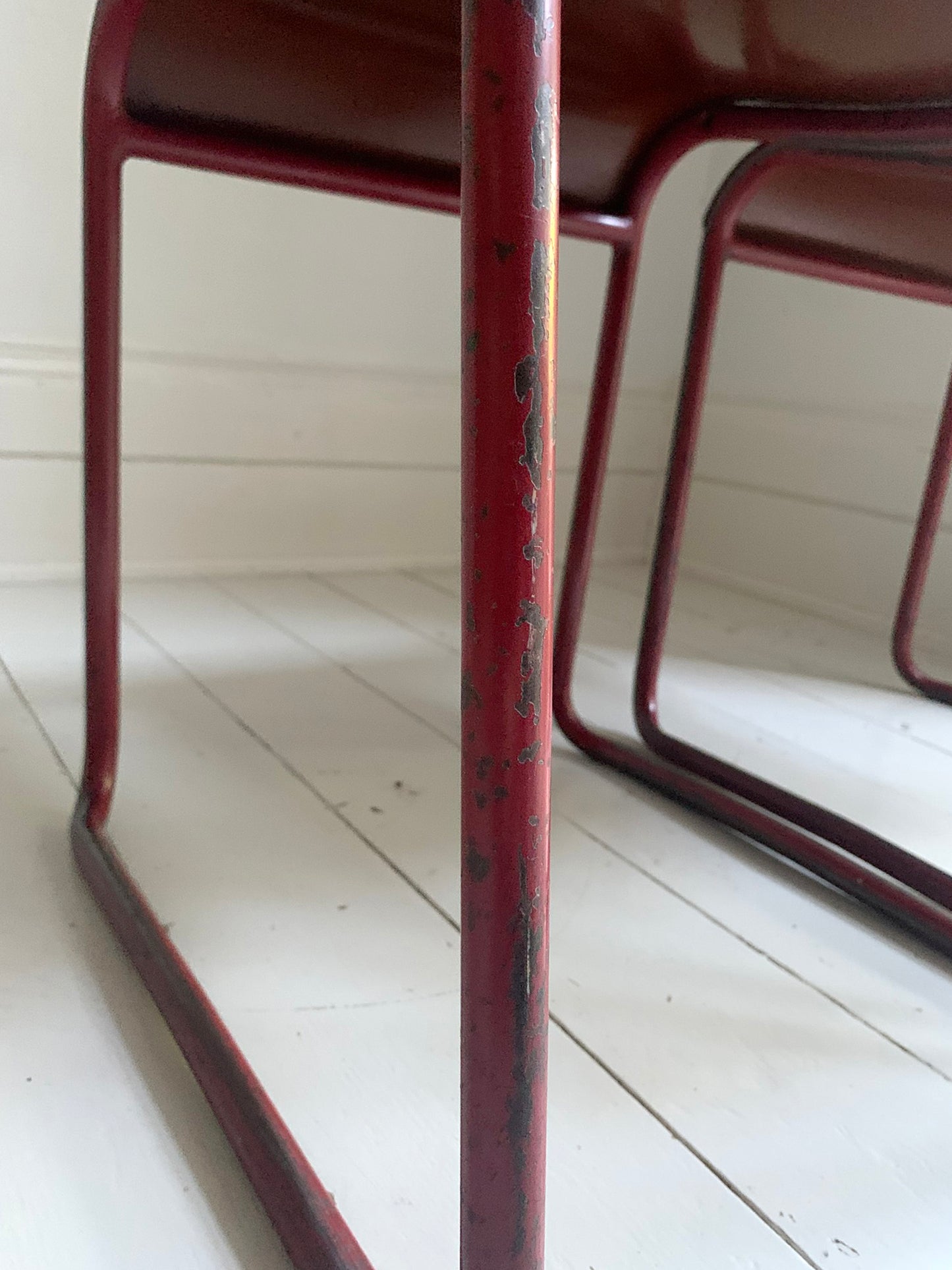 Vintage Cox Stacking Chairs; A Pair Tubular Steel Chairs with Rich Red Patina